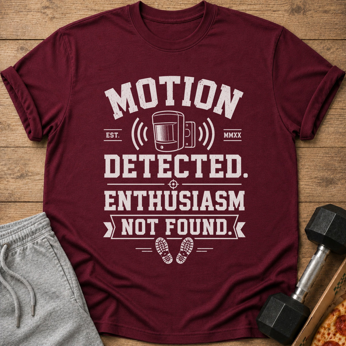 Maroon t-shirt with "Motion Detected. Enthusiasm Not Found." text and graphics.