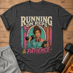T-shirt with text "RUNNING ON REPS & PATIENCE" and a woman holding dumbbells.