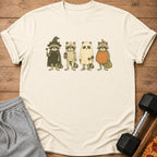 Four raccoons in Halloween costumes: witch, mummy, ghost, and pumpkin.