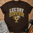 Brown t-shirt with "LEG DAY SURVIVOR" text and trophy graphic.