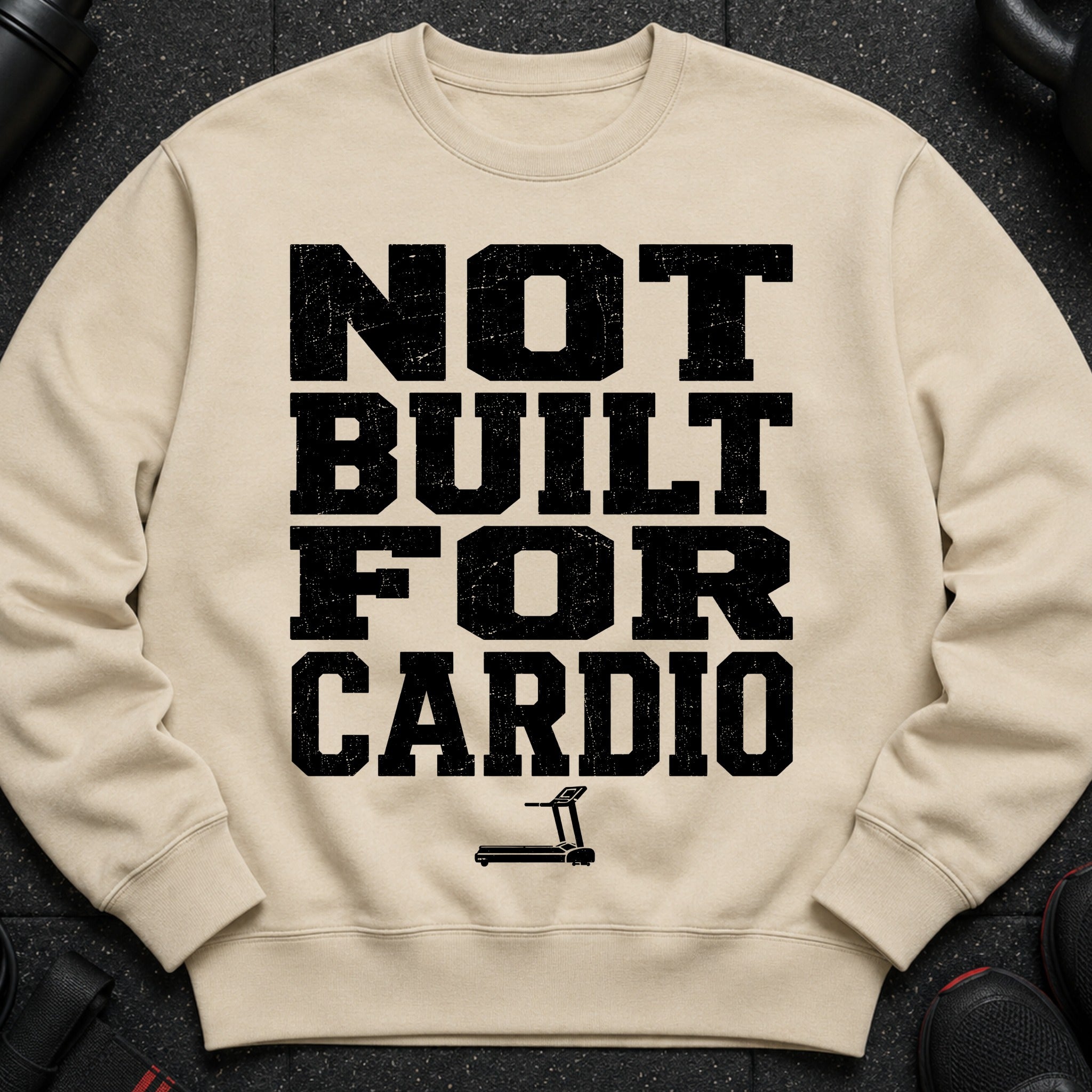 Crewneck sweatshirt with black distressed text "NOT BUILT FOR CARDIO" and treadmill graphic.