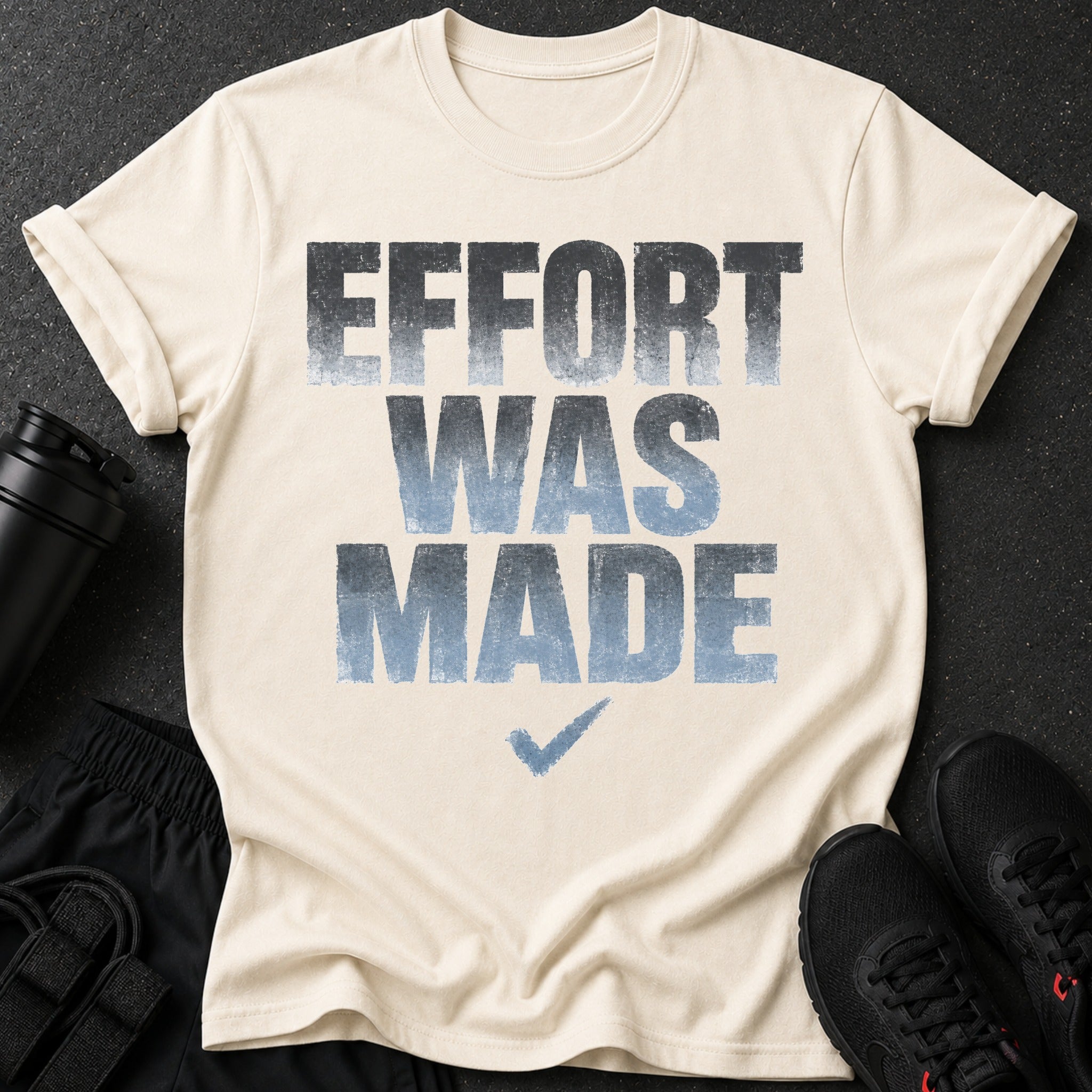 Cream t-shirt with "EFFORT WAS MADE" text and checkmark.
