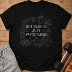 Black t-shirt with gym illustrations and text "Not Peaking. Just Participating."