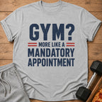Grey t-shirt with "GYM? MORE LIKE A MANDATORY APPOINTMENT" text.