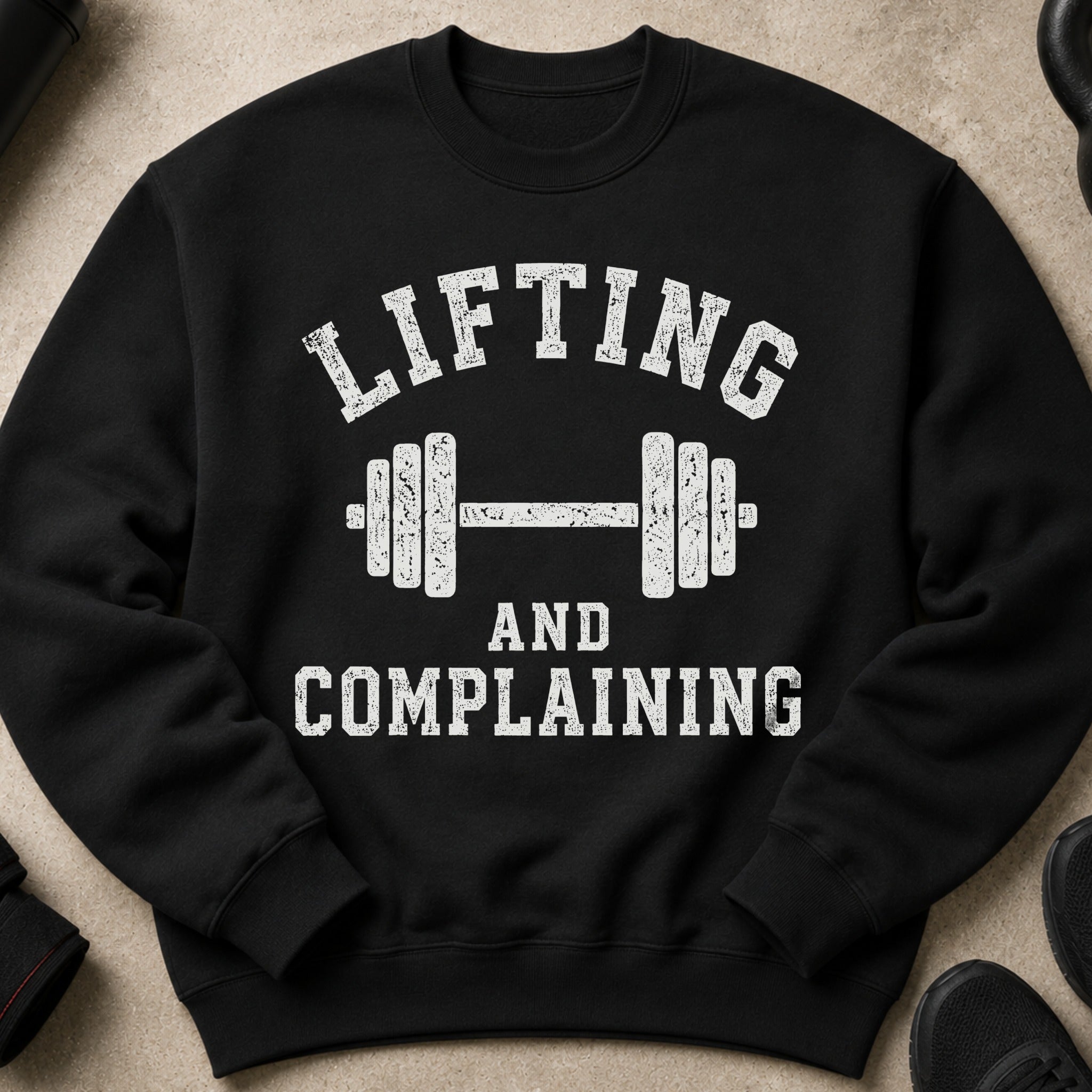 Black crewneck sweatshirt with "Lifting and Complaining" text and dumbbell graphic.