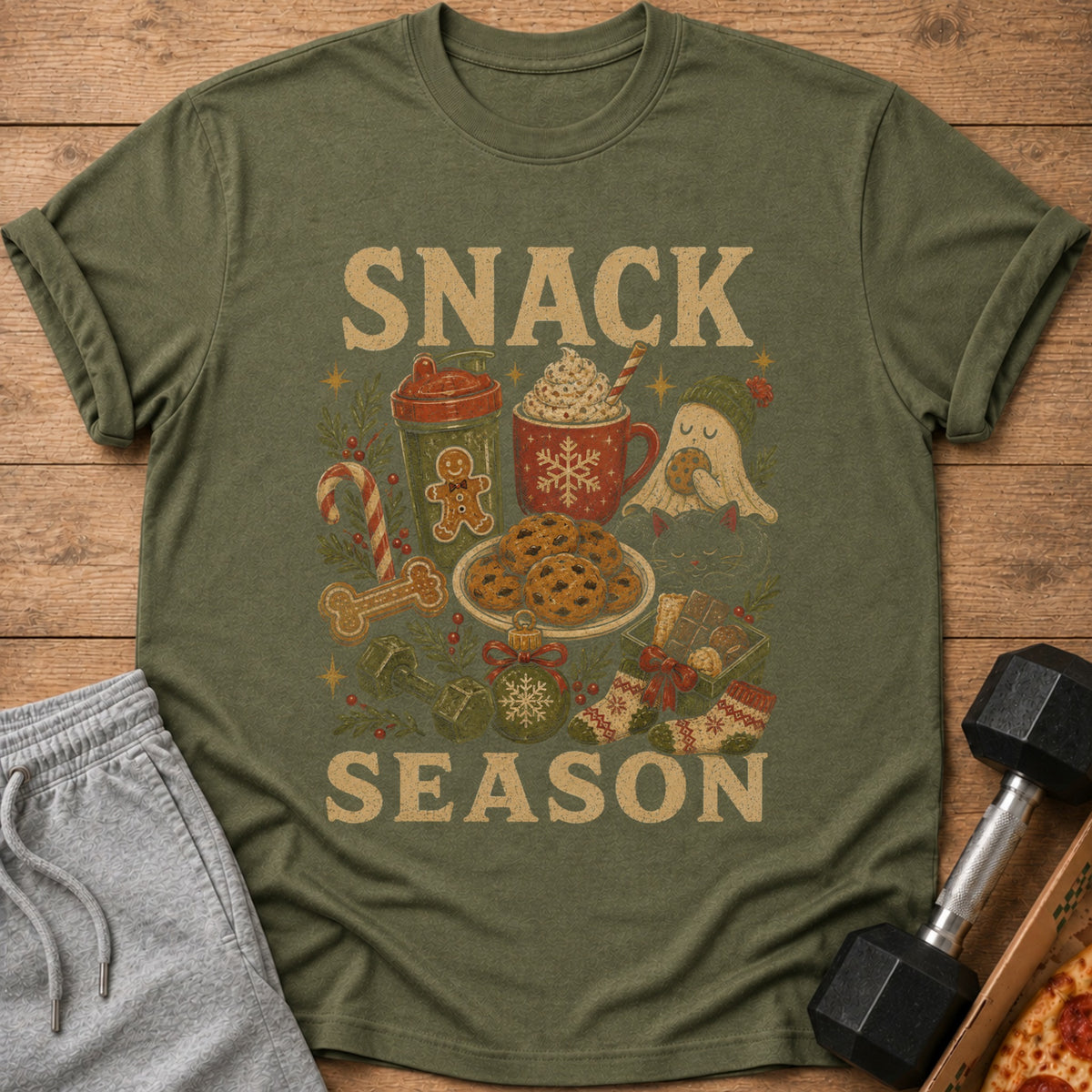 Green t-shirt with "SNACK SEASON" text and festive holiday illustrations.