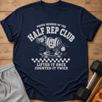 Navy t-shirt with "Proud Member of the Half Rep Club" and cartoon weightlifting barbell on skateboard.