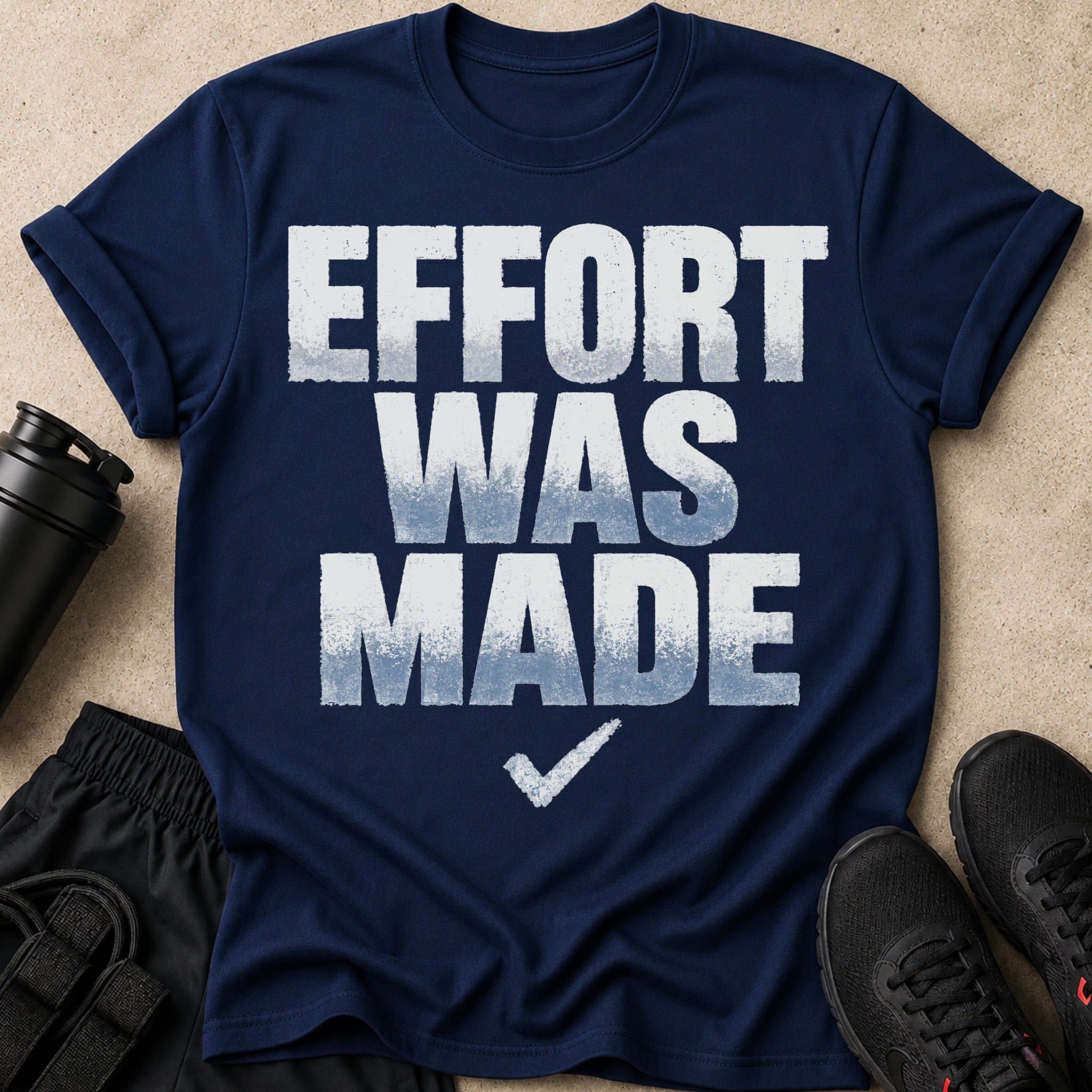 Navy t-shirt with white text "EFFORT WAS MADE" and a checkmark.