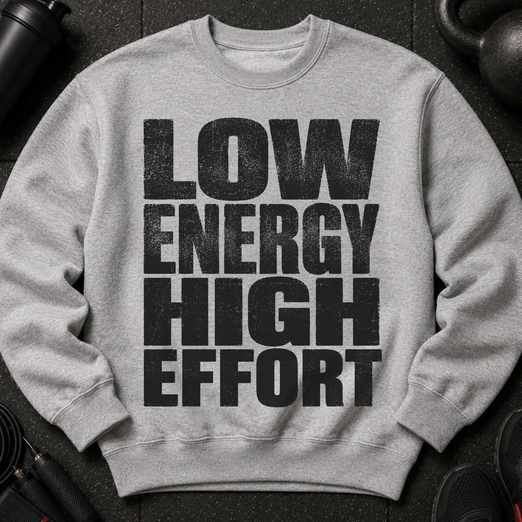 Grey crewneck sweatshirt with black distressed text reading "LOW ENERGY HIGH EFFORT".