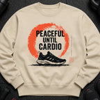 Light brown sweatshirt with "Peaceful Until Cardio" text and running shoe graphic.