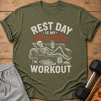 Olive t-shirt with skeleton on couch, pizza, and dumbbell, reading "Rest Day is My Favorite Workout."