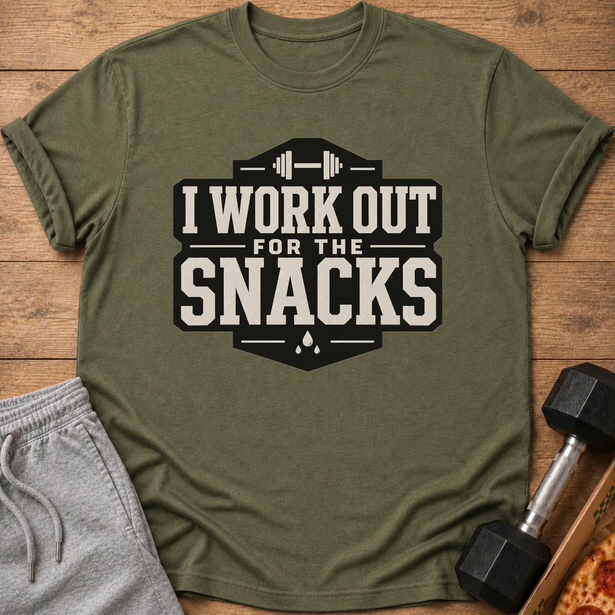 Green t-shirt with text "I WORK OUT FOR THE SNACKS" and dumbbell.
