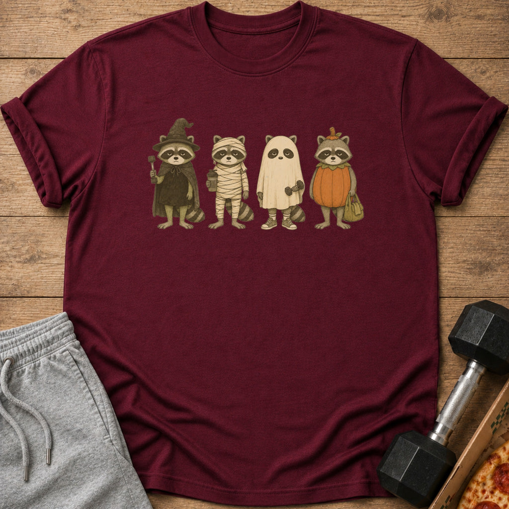 Four raccoons in Halloween costumes: witch, mummy, ghost, and pumpkin.