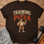 Brown t-shirt with graphic "Training for Pizza" and a cartoon man holding pizza.