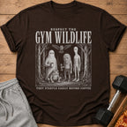 Brown t-shirt with "Respect the Gym Wildlife" and quirky creatures, text at bottom.