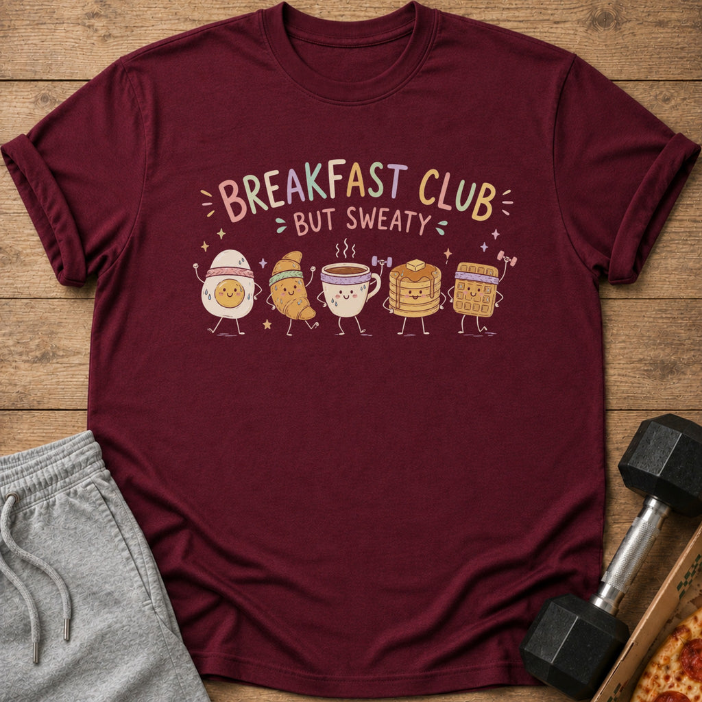 Maroon t-shirt with "Breakfast Club But Sweaty" text and cartoon breakfast foods.