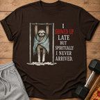 Brown t-shirt featuring a sloth hanging from a bar, text reads "I showed up late but spiritually I never arrived."