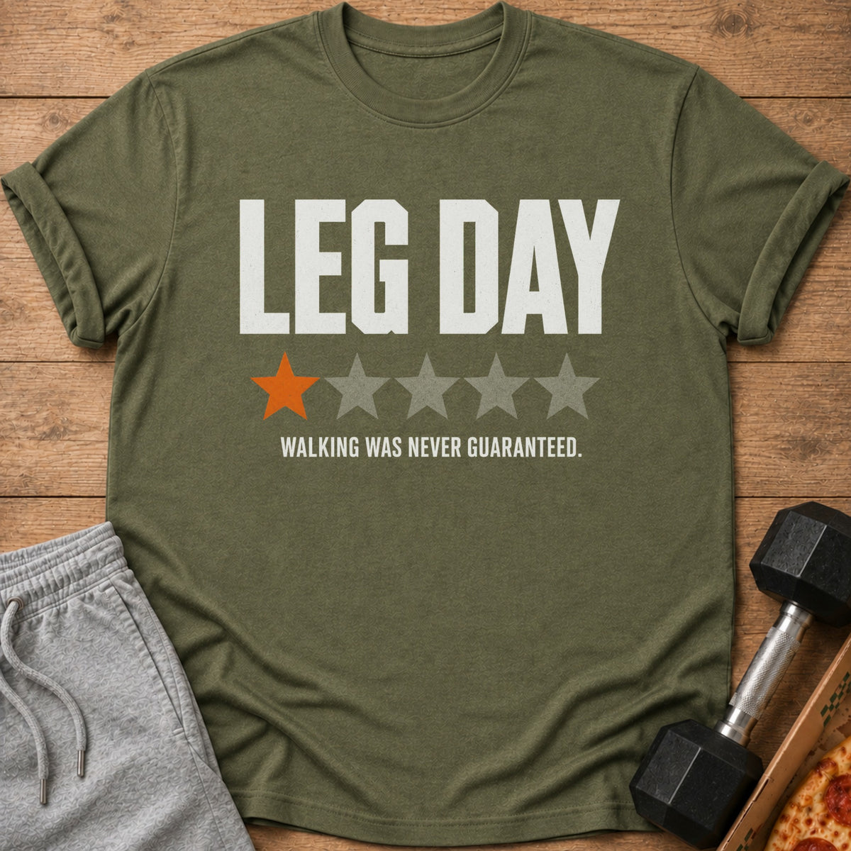 Green t-shirt with "LEG DAY" text, one orange star, and four grey stars.