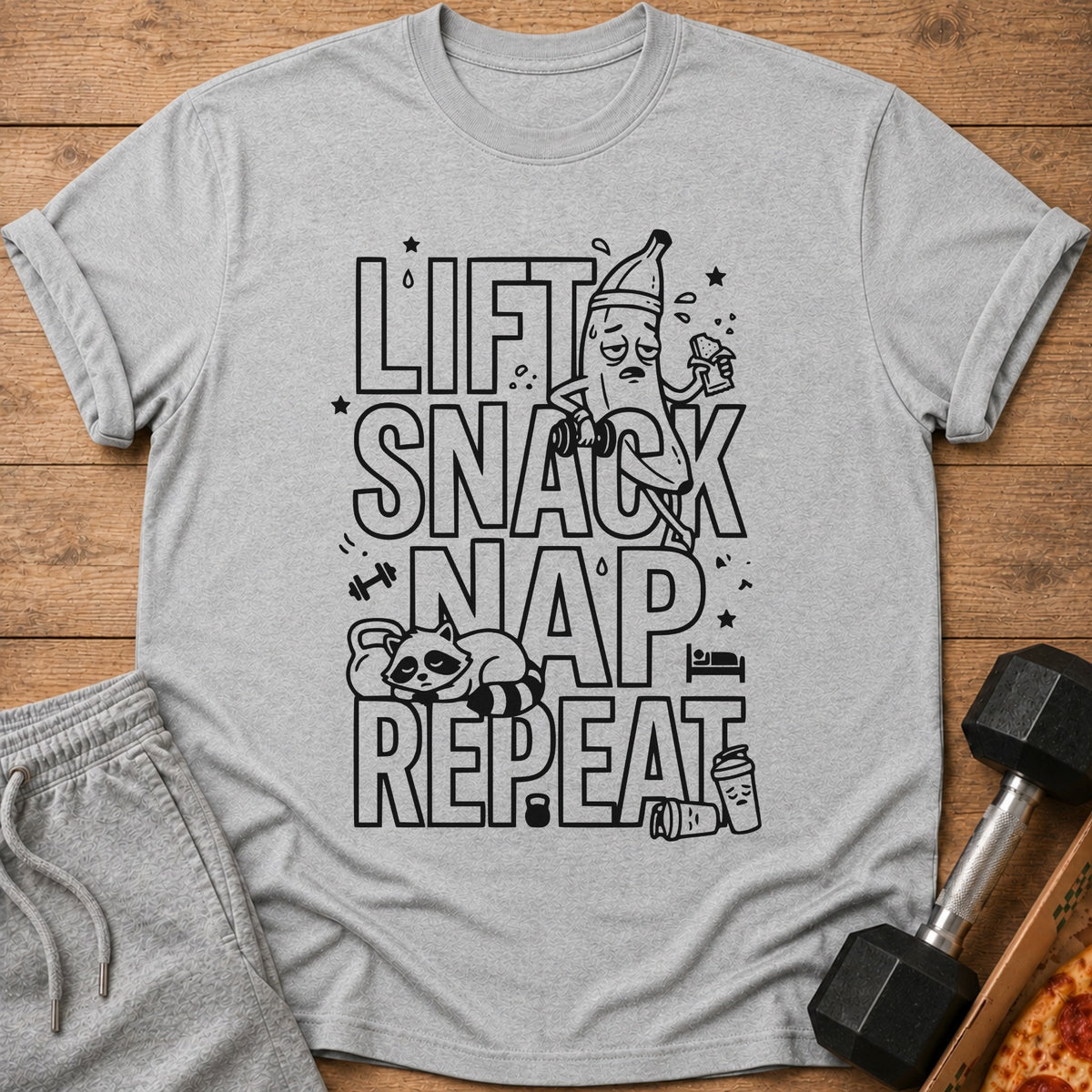 Gray t-shirt with "Lift Snack Nap Repeat" text and gym graphics.