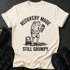 Cream t-shirt with a grumpy frog holding a shaker and text "Recovery Mode Still Grumpy."