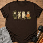 Four raccoons in Halloween costumes: witch, mummy, ghost, and pumpkin.