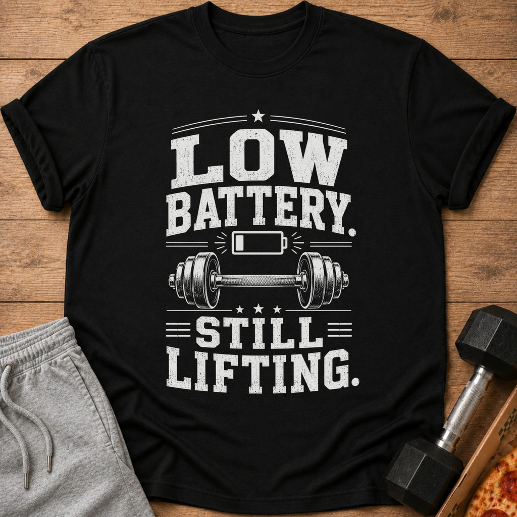 Black t-shirt with "Low Battery. Still Lifting." text and dumbbell graphic.