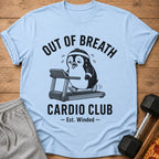 Light blue t-shirt with cartoon penguin on treadmill and text "OUT OF BREATH CARDIO CLUB".