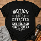 Black t-shirt with text "Motion Detected. Enthusiasm Not Found." and a motion sensor graphic.