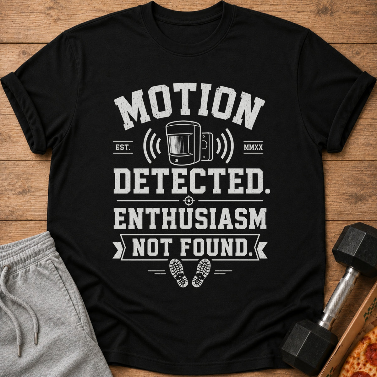 Black t-shirt with text "Motion Detected. Enthusiasm Not Found." and a motion sensor graphic.