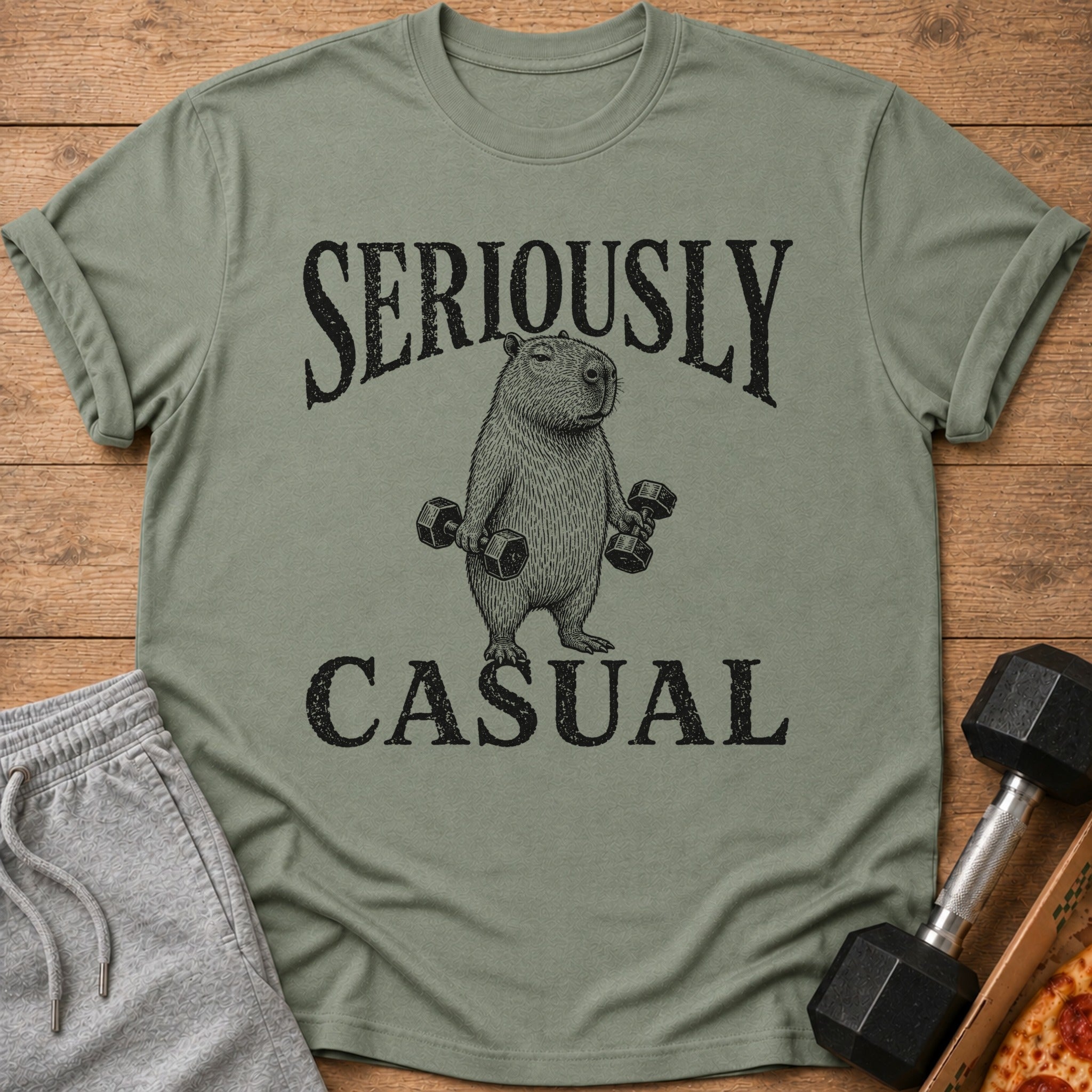 T-shirt with capybara lifting dumbbells, text "SERIOUSLY CASUAL".