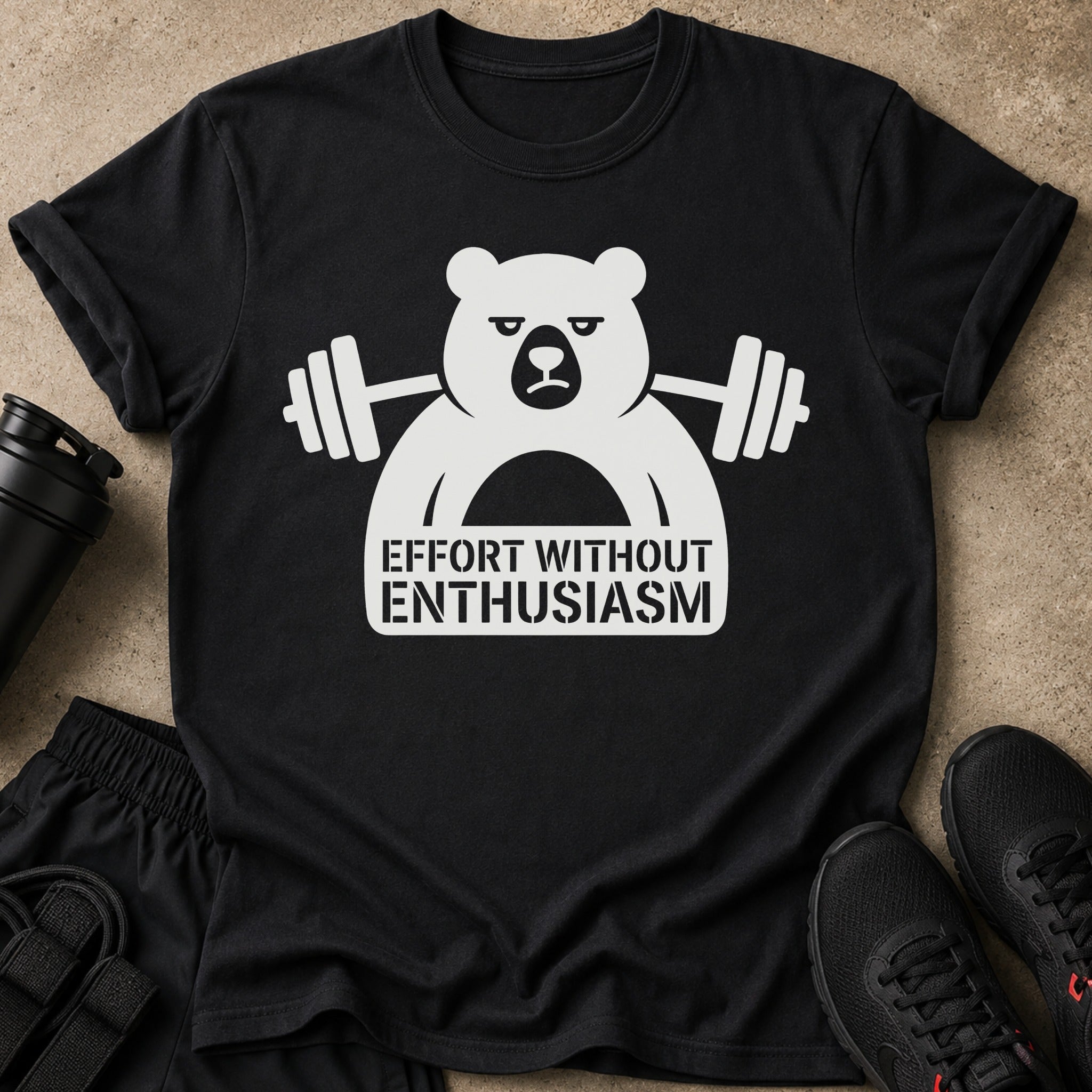Black t-shirt with white graphic of a bear lifting weights, "Effort Without Enthusiasm."