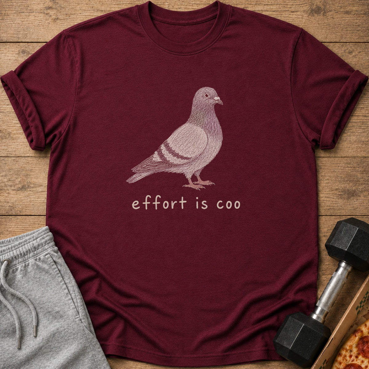 Maroon t-shirt with a pigeon graphic and the text "effort is coo".