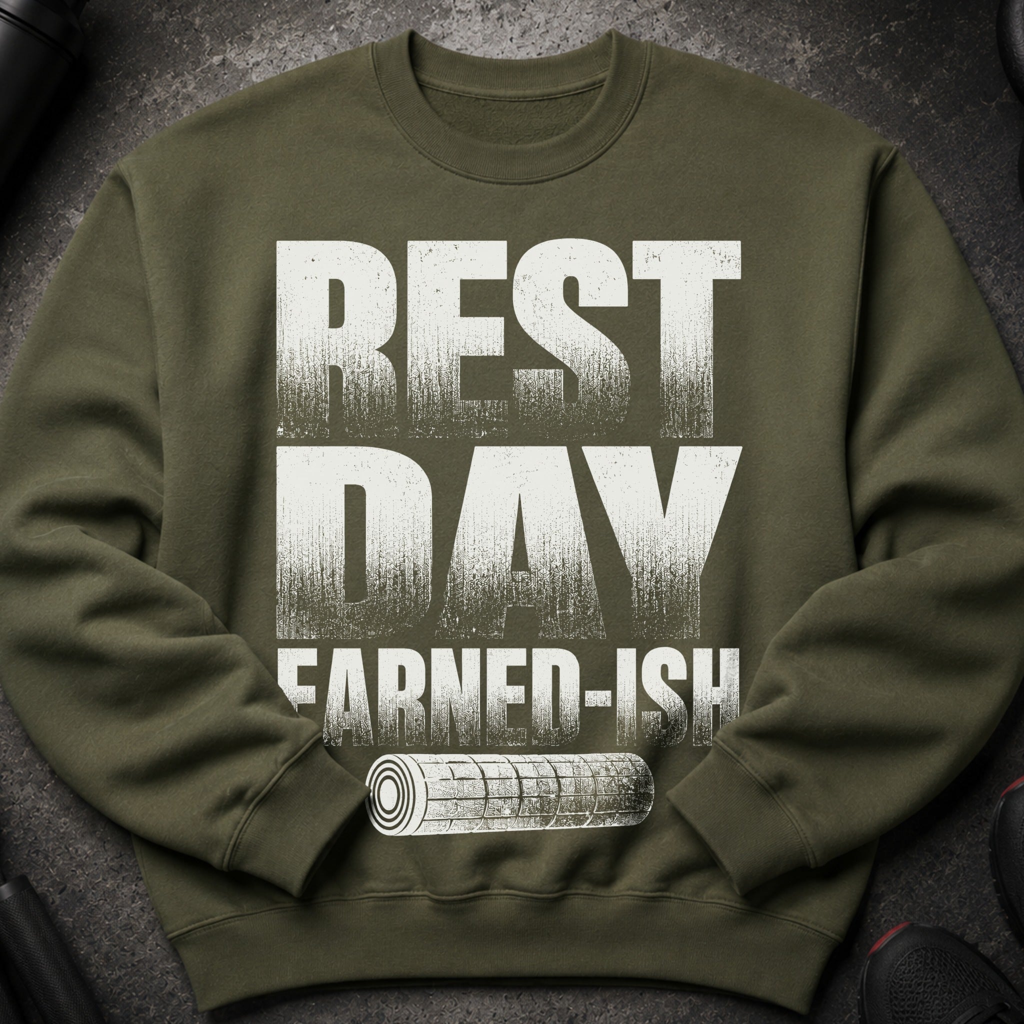 Olive green sweatshirt with "REST DAY EARNED-ISH" and a rolled-up mat graphic.