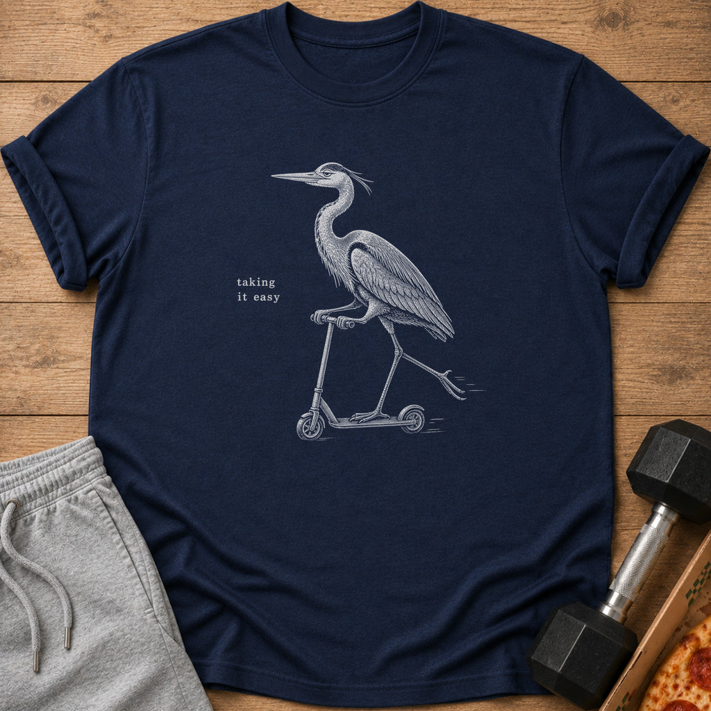 Navy t-shirt with a drawing of a heron riding a scooter and the text "taking it easy".