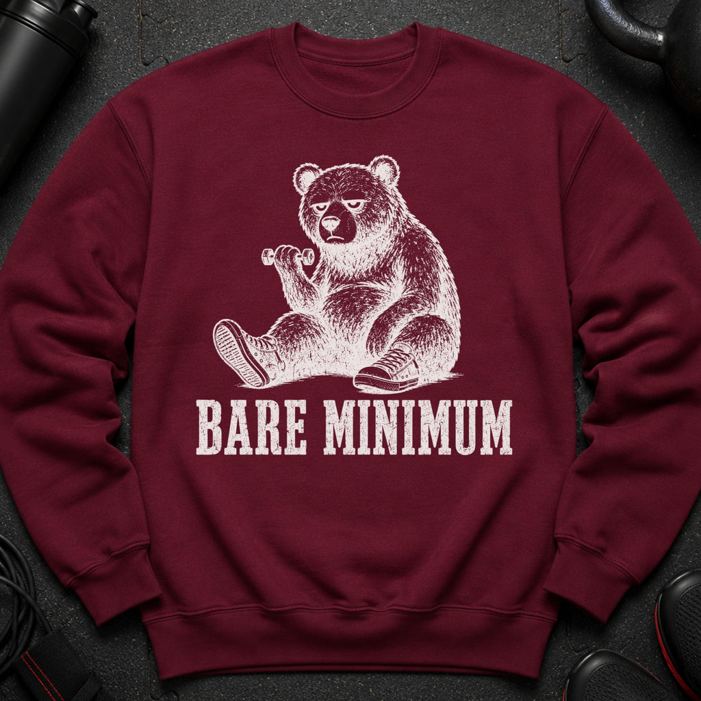 Maroon sweatshirt with a white graphic of a bear holding a dumbbell and the text "BARE MINIMUM".