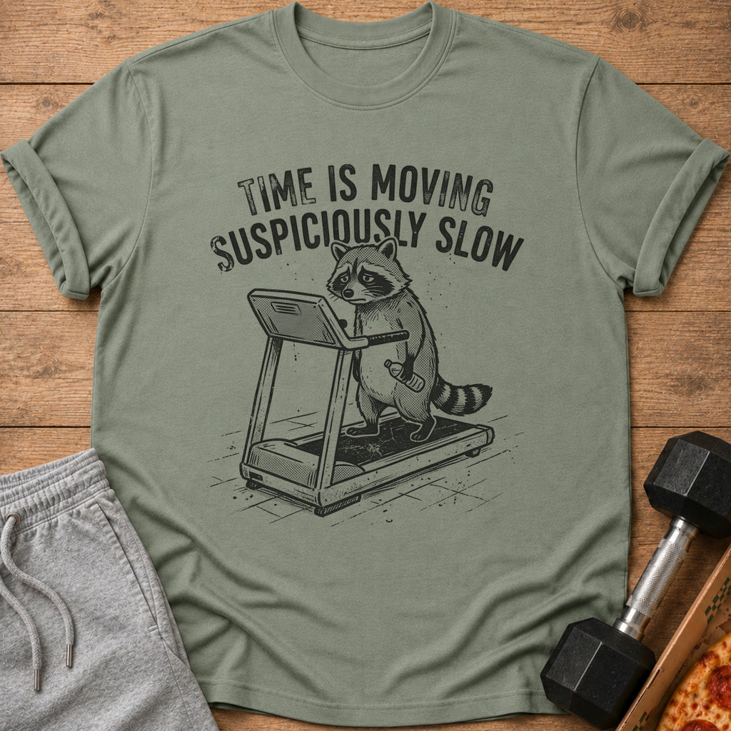 T-shirt with raccoon on treadmill, text "TIME IS MOVING SUSPICIOUSLY SLOW".