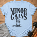 Light blue t-shirt with "MINOR GAINS" text and a mouse lifting a dumbbell.