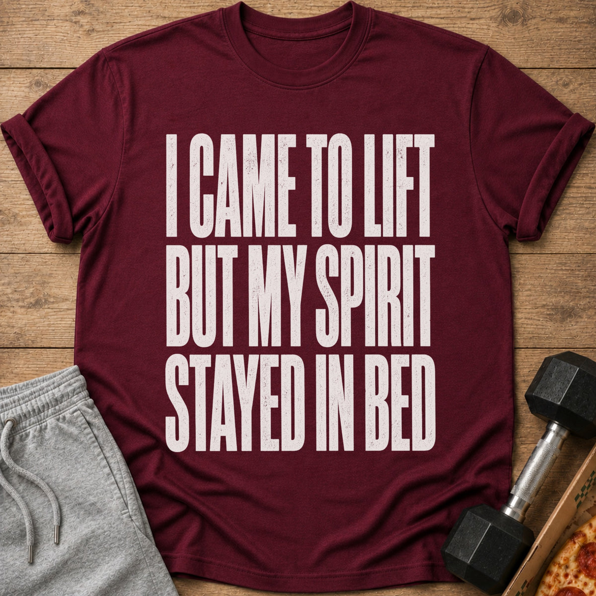 Maroon t-shirt with text "I CAME TO LIFT BUT MY SPIRIT STAYED IN BED."