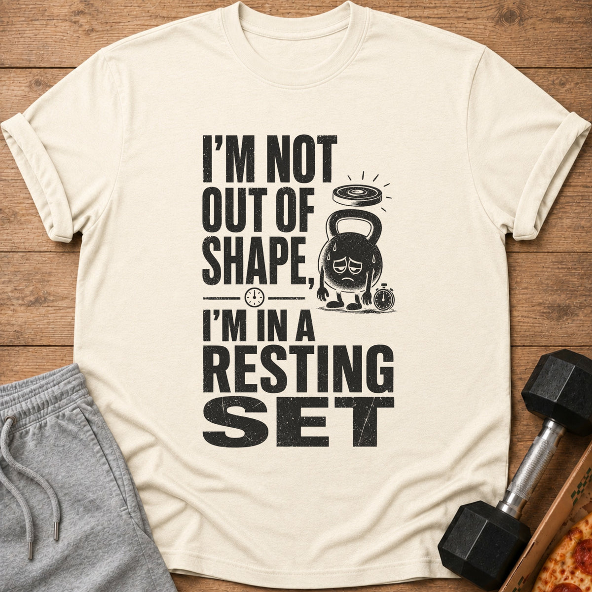Cream t-shirt with black text reading "I'm not out of shape, I'm in a resting set"