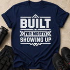 Navy t-shirt with white text that reads "BUILT FOR MOSTLY SHOWING UP".