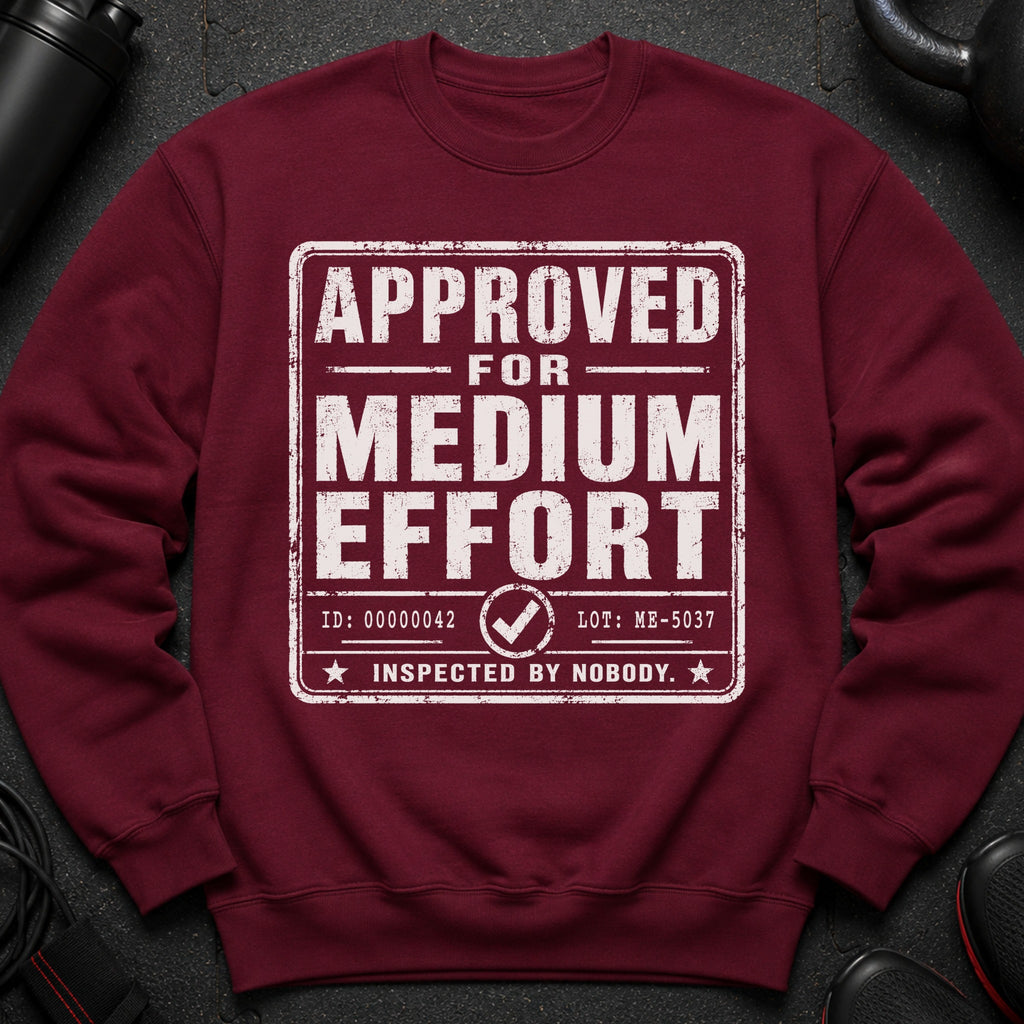 Maroon sweatshirt with "APPROVED FOR MEDIUM EFFORT INSPECTED BY NOBODY" text.