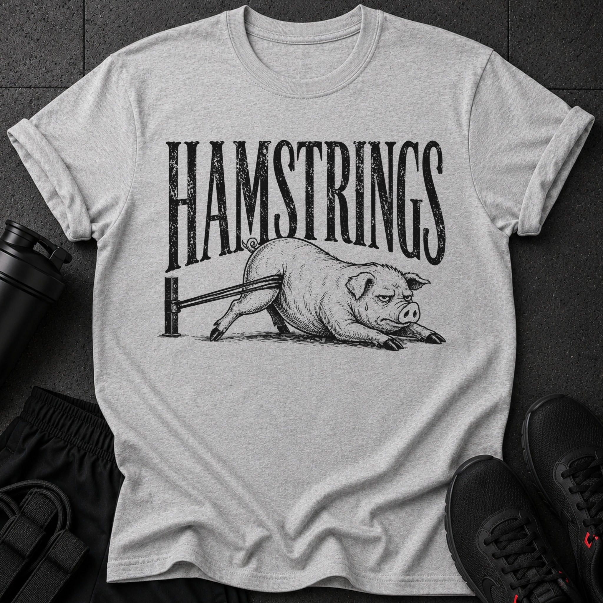 Grey t-shirt with "HAMSTRINGS" text and distressed pig graphic.