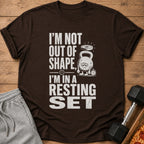 Brown t-shirt featuring distressed white text that reads I'm not out of shape, I'm in a resting set.
