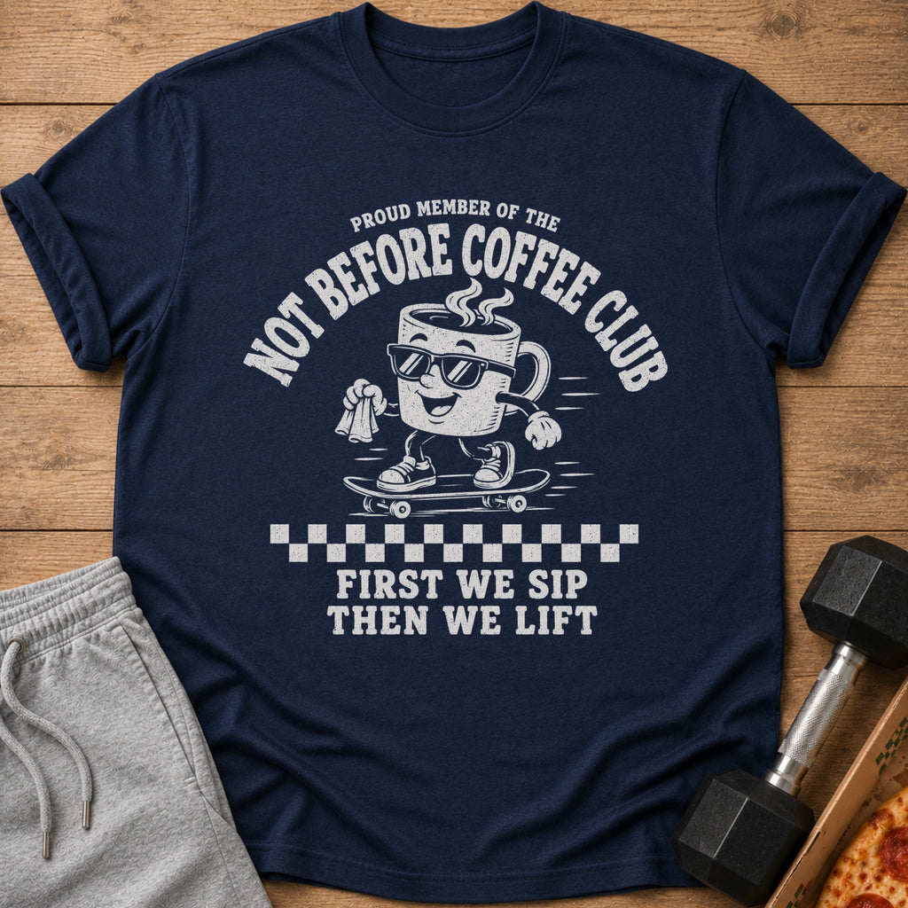 Navy t-shirt with "Not Before Coffee Club" and skateboarding coffee cup graphic.