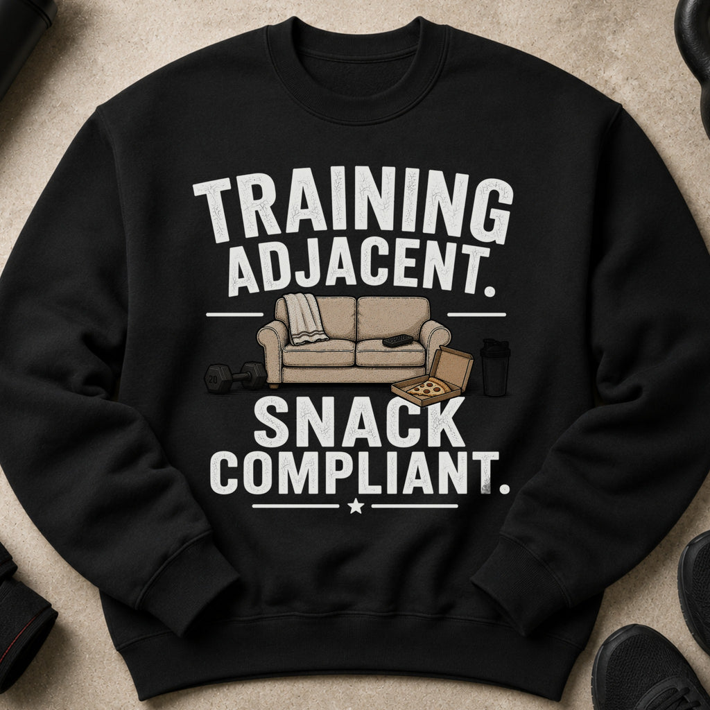 Black sweatshirt with "TRAINING ADJACENT. SNACK COMPLIANT." text and graphic.