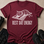 Maroon t-shirt with a distressed graphic of a grumpy cat and the text "Rest Day Energy".