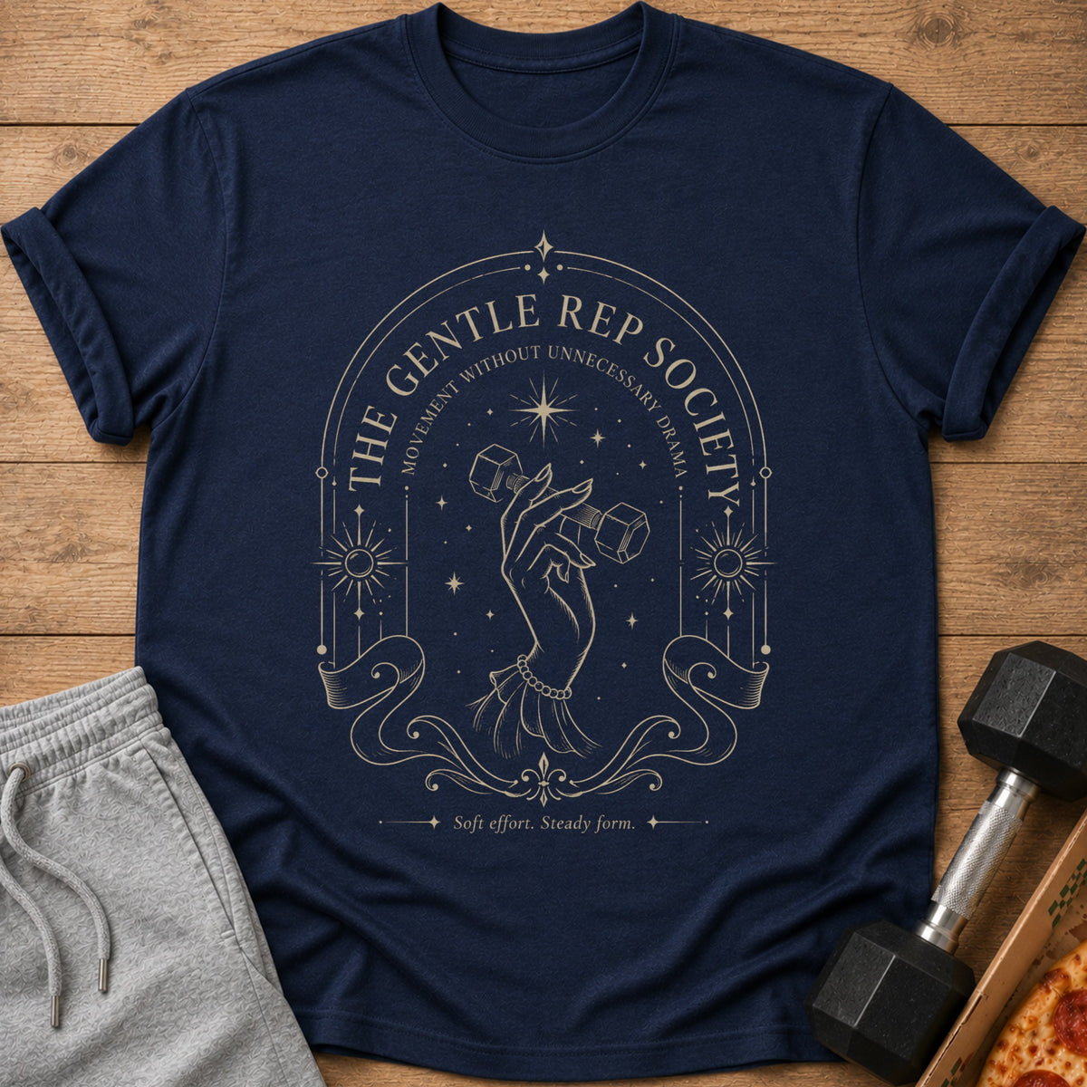 Navy t-shirt with "The Gentle Rep Society" text, a hand holding a dumbbell, and celestial graphics.