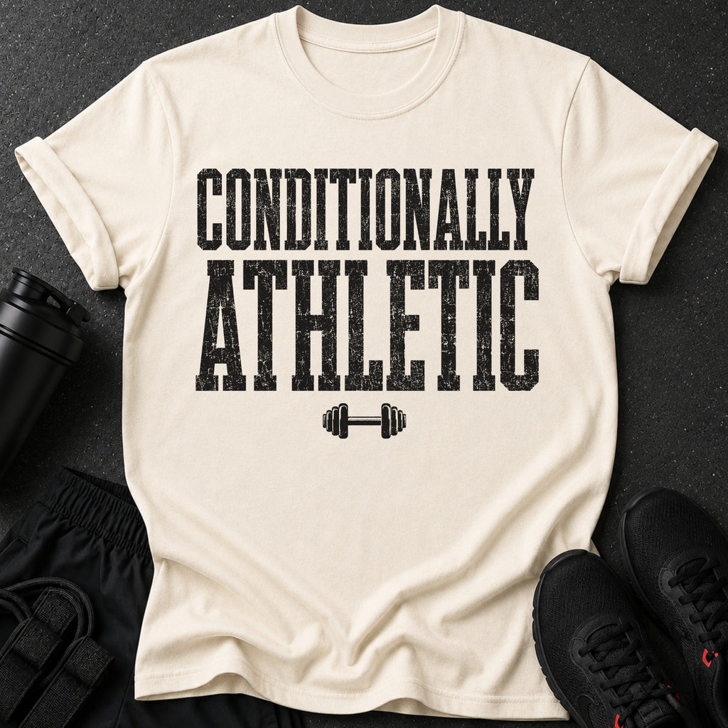 Cream t-shirt with black distressed text "CONDITIONALLY ATHLETIC" and a dumbbell graphic.