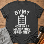 Dark grey t-shirt with distressed text "GYM? MORE LIKE A MANDATORY APPOINTMENT".