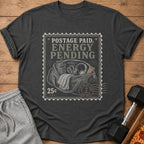 Dark t-shirt with postage stamp graphic: "POSTAGE PAID, ENERGY PENDING" and gym bag.